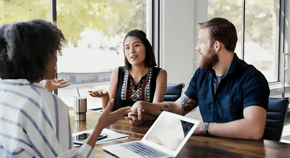 Homebuyers meeting with a mortgage lender to discuss buying a home and financing options
